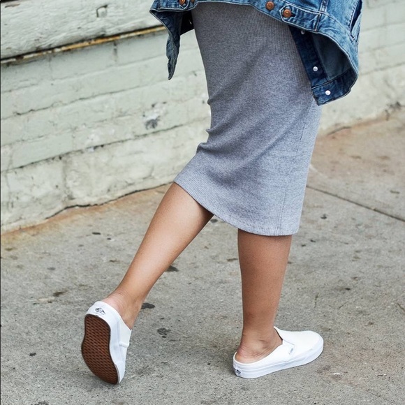 white vans slip ons on feet